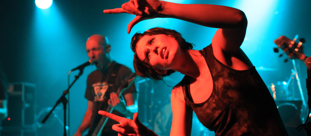 Sign language interpreter signs at a heavy metal concert